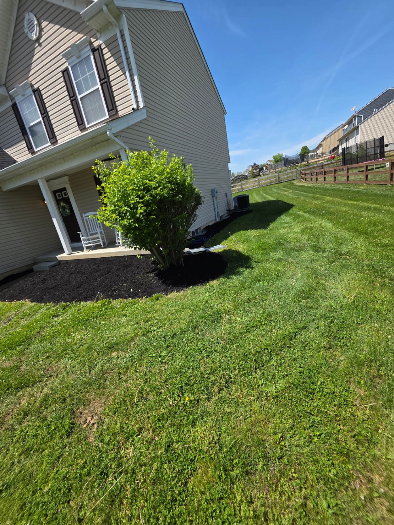 Side yard freshly mulched with crisp edging